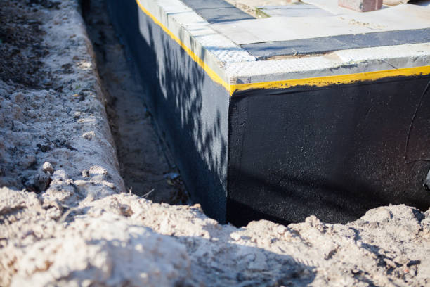 Professional Waterproofing technician working in Holton, MI
